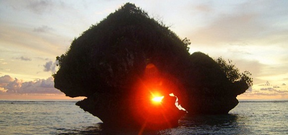 Sunrise in the heart of the rock on a small tropical island, Guam, Photo Lama Tantrapa